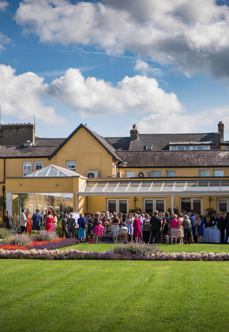 Bride and groom in hotel gardens