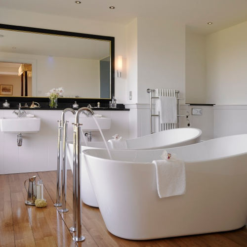 Twin Baths With Orchids